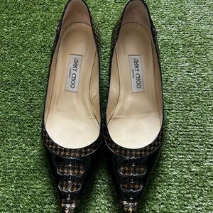 Jimmy Choo Black Heels with Pointed Toe and Metallic Accents